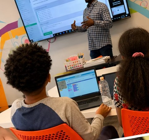Students building a project in an ARK coding class